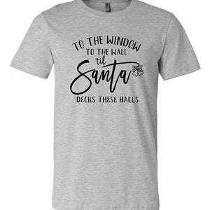 To the window to the wall til Santa decks these halls unisex tshirt