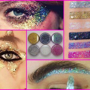 K&ouml;nnte beinhalten: Sechs kleine Gl&auml;ser mit Glitter in verschiedenen Farben, darunter Gold, Silber, Wei&szlig;, Blau und Pink. Der Glitter wird auf wei&szlig;em Hintergrund gezeigt. Der Glitter kann f&uuml;r Make-up, Basteln und andere dekorative Zwecke verwendet werden.