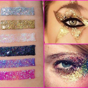 May include: Six different colors of glitter, including silver, gold, white, black, purple, and pink, are shown in swatches on a person's arm. The glitter is in a liquid form and is ready to be applied to the eyelids. The image also shows two examples of how the glitter can be used to create eye makeup looks.