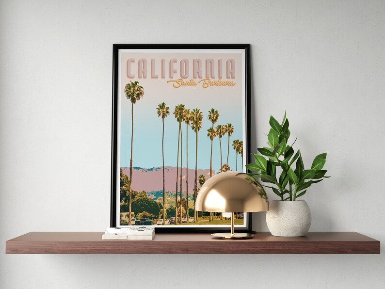 May include: A framed print with a retro design featuring palm trees and the text "CALIFORNIA Santa Barbara".