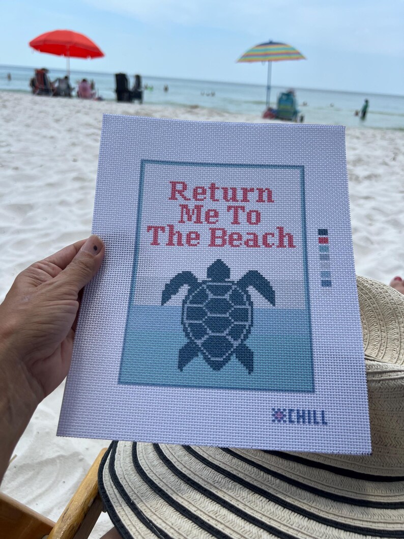May include: A needlepoint canvas with the text "Return Me To The Beach" above a turtle graphic. The design features shades of blue and is set against a white background. The word "CHILL" is at the bottom.