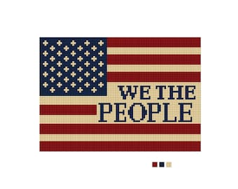 May include: A pixelated American flag design with the words "WE THE PEOPLE" in a bold font. The flag features red and white stripes, a blue field with white stars, and the text in a dark blue color.