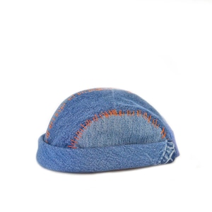 Unique 4 Panel Docker Cap. Handmade from different, used denim w/contrasting red stitchings. Adjustable one size M-L.