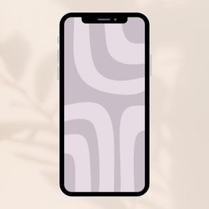 May include: A black smartphone displays a light purple and gray abstract design on its screen. The design features curved, layered shapes. The phone is set against a neutral, off-white background with subtle shadow details.