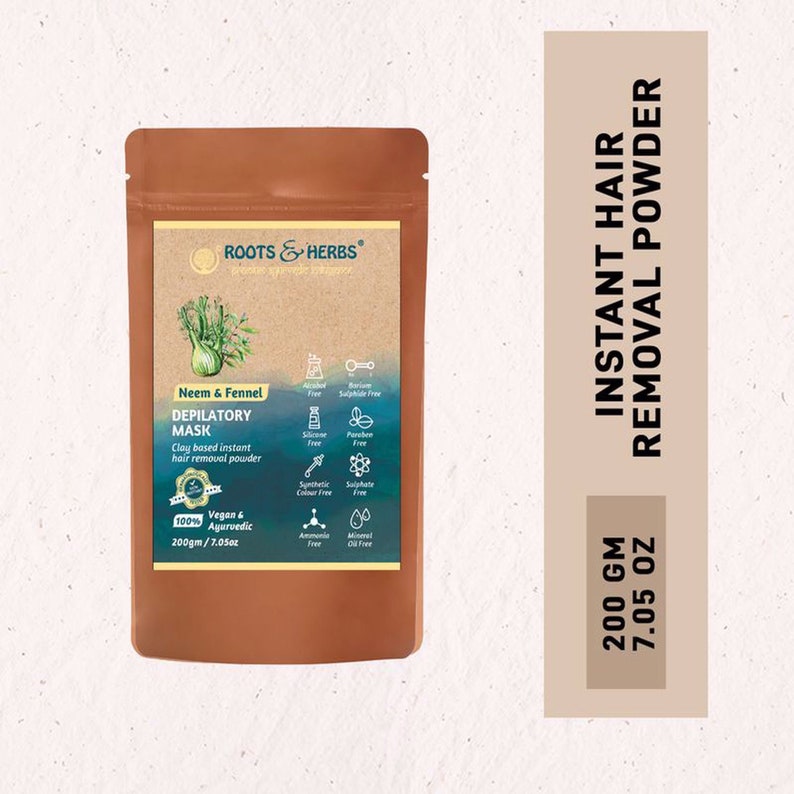 May include: A brown pouch with a label that reads "ROOTS & HERBS" and "Neem & Fennel DEPILATORY MASK". The pouch contains a clay-based instant hair removal powder. The label also lists ingredients and states that the product is 100% vegan and ayurvedic. The pouch is labeled with "200gm / 7.05oz". The pouch is sitting on a light brown background with the text "INSTANT HAIR REMOVAL POWDER" and "200 GM 7.05 OZ" in black.
