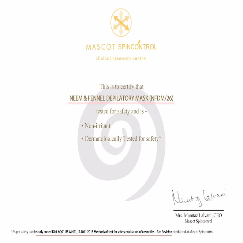 May include: A white certificate with a red border, certifying that Neem & Fennel Depilatory Mask (NFDM/26) has been tested for safety and is non-irritant and dermatologically tested for safety. The certificate is signed by Mrs. Mumtaz Lalvani, CEO of Mascot Spincontrol.