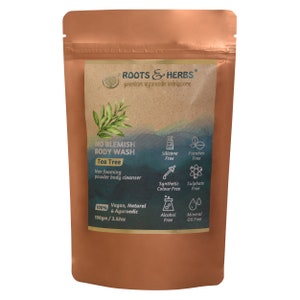 May include: A brown pouch with a label that reads "ROOTS & HERBS" and "NO BLEMISH BODY WASH Tea Tree". The label also lists ingredients and features, including "Vegan, Natural & Ayurvedic", "100gm / 3.52oz", and "Silicone Free, Paraben Free, Synthetic Colour Free, Sulphate Free, Alcohol Free, Mineral Oil Free".