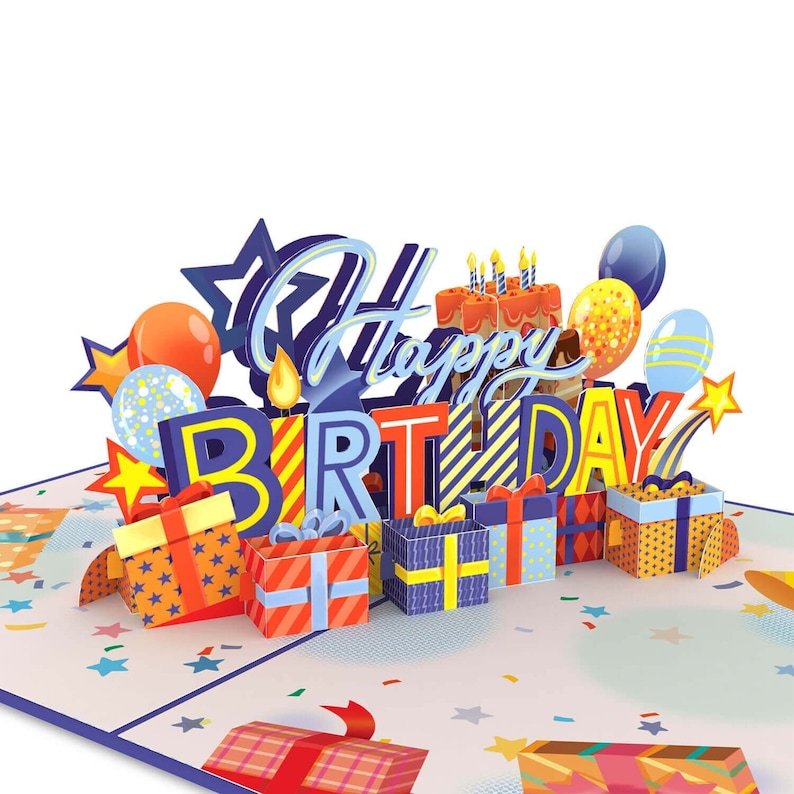 Pu&ograve; includere: Un biglietto di auguri di compleanno 3D pop-up con un design colorato. Il biglietto presenta le parole "Buon compleanno" in lettere blu e gialle, con regali, palloncini e una torta con candele.