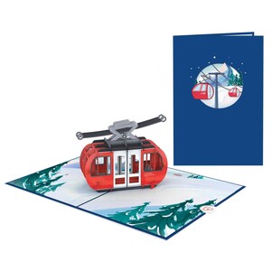 May include: A red and white 3D pop-up card featuring a cable car with a snowy mountain scene in the background. The card is open and the cable car is in the foreground. The card is blue on the outside.