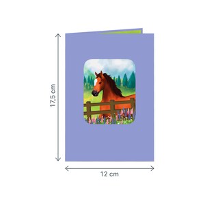 May include: A purple card with a window showing a brown horse with a white star on its forehead standing in a field of flowers. The card measures 12 cm by 17.5 cm.