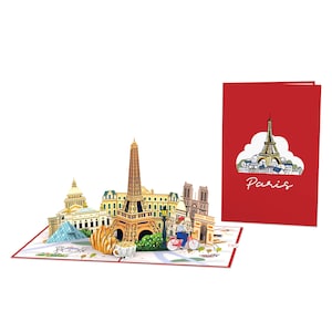 Puede incluir: Una tarjeta pop-up 3D que presenta monumentos emblem&aacute;ticos de Par&iacute;s, como la Torre Eiffel, el Louvre y la Catedral de Notre Dame. La tarjeta est&aacute; abierta, revelando un paisaje urbano detallado con una persona en bicicleta y un croissant en una mesa. La cubierta de la tarjeta es roja con una nube blanca y la palabra "Par&iacute;s" en cursiva.