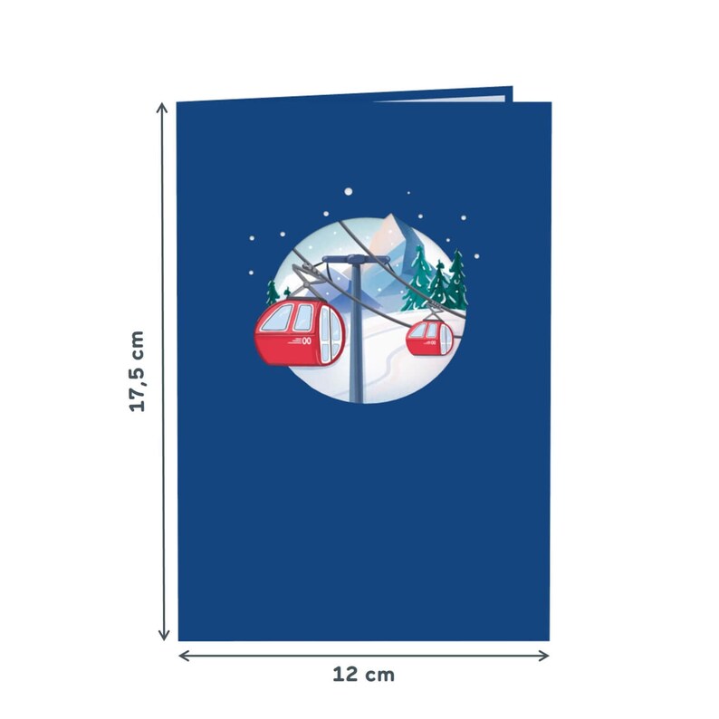 May include: A blue card with a pop-up design of a snowy mountain scene with two red cable cars. The card measures 12 inches by 17.5 inches.