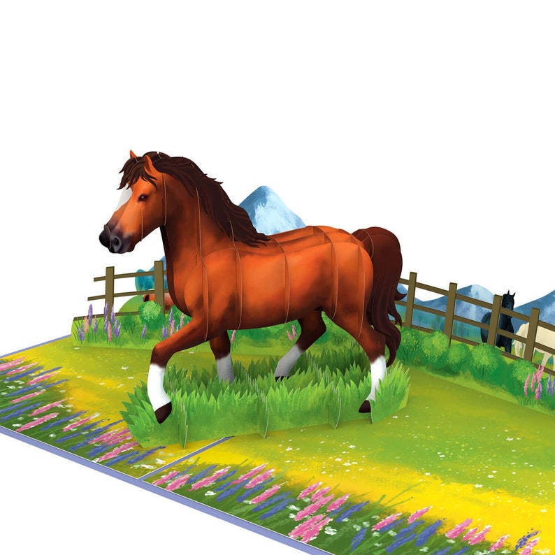 May include: A 3D pop-up card depicting a brown horse galloping through a field of green grass and purple flowers. The horse has a white blaze on its face and white socks on its legs. The background features a wooden fence, green hills, and a blue sky.