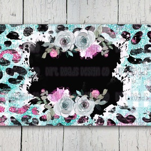 May include: A teal and black leopard print background with a black circle in the centre. The circle is surrounded by white and pink flowers. The text "Our Roads Design Co." is written in white inside the circle.