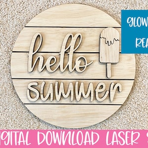 May include: A round wooden sign with the text "hello summer" and a popsicle graphic. The sign is made of wood and has a light brown colour.
