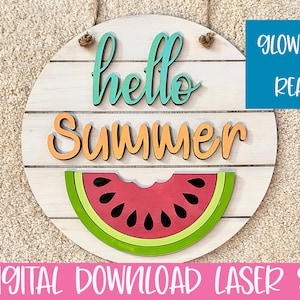 May include: A round wooden sign with the text "hello summer" in colourful letters. A watermelon slice is below the text. The sign is ready to be cut on a Glowforge.