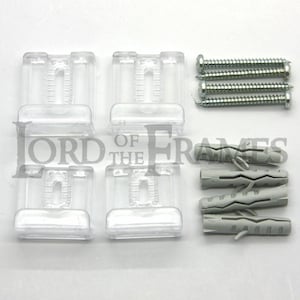 May include: Four clear plastic picture frame hanging brackets, four grey plastic wall plugs, and three silver screws.