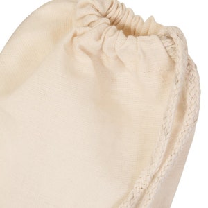 May include: A plain white cotton drawstring bag with a white cotton drawstring.