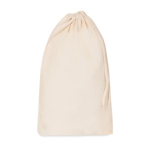 May include: A plain white cotton drawstring bag with a gathered top and a long drawstring.