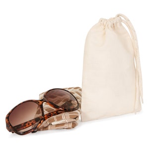 May include: Brown and tan patterned sunglasses with a brown case and a white drawstring bag.