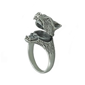 May include: A silver ring featuring a wolf head design that opens to reveal a small compartment. The wolf's mouth is open and its teeth are visible.