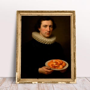 May include: A framed vintage portrait of a person in a black outfit and a white ruffled collar, holding a plate of cooked shrimp. The portrait is in a gold ornate frame, with a dark background.