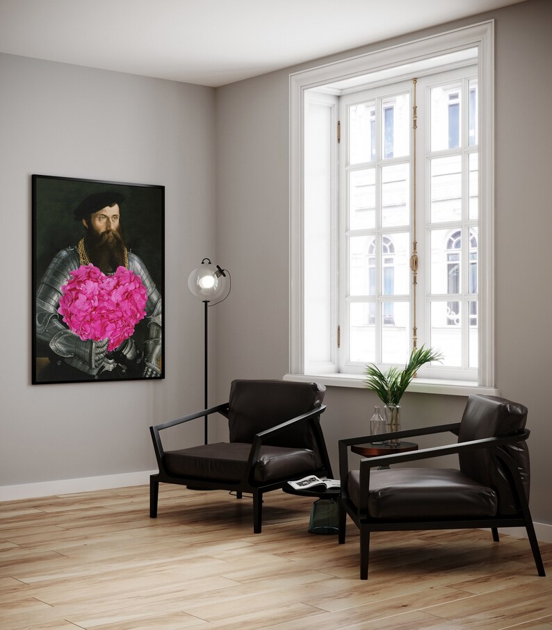 May include: A painting of a man in armor holding a large pink heart-shaped bouquet of flowers. The painting is hanging on a gray wall in a room with two black leather chairs and a floor lamp.