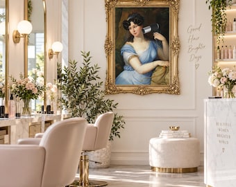 May include: A framed oil painting of a person in a blue dress holding a modern black hair dryer, displayed on a wall in a salon. The ornate gold frame surrounds the portrait, which is positioned above a white ottoman and near wall text.