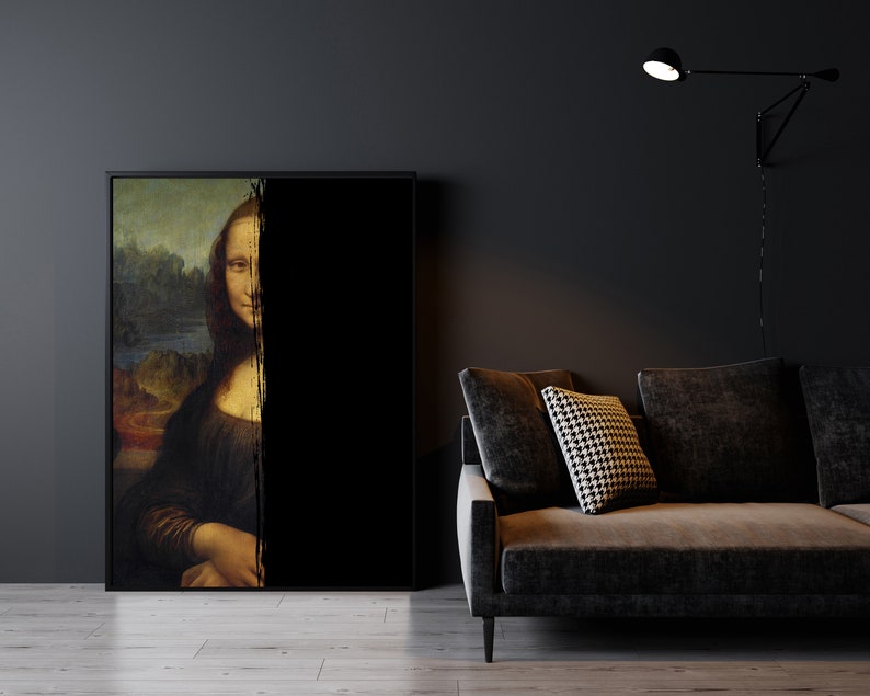 May include: A framed print of the Mona Lisa, partially obscured by a black vertical stripe. The artwork is set in a modern living room with a dark grey sofa and a black wall-mounted lamp. The room has a dark colour scheme.