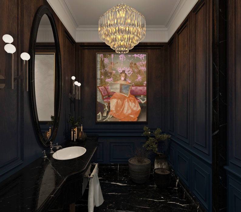 May include: A black and white bathroom with a large oval mirror, a white porcelain sink, and a framed painting of a woman in a pink dress. The walls are dark wood paneling and the floor is black marble.