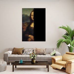 May include: A framed print of the Mona Lisa, with a vertical black stripe obscuring half the image. The painting shows a woman in dark attire with a faint smile. The print is displayed above a grey sofa in a living room.