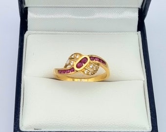 Franse vintage 18K gouden crossover-ring met robijn en diamant