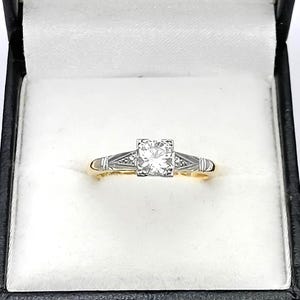 Bague solitaire diamant sur or 18K et platine