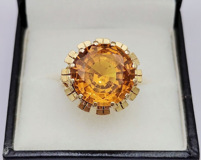 Vintage 18K gold cocktail ring with orange sapphire