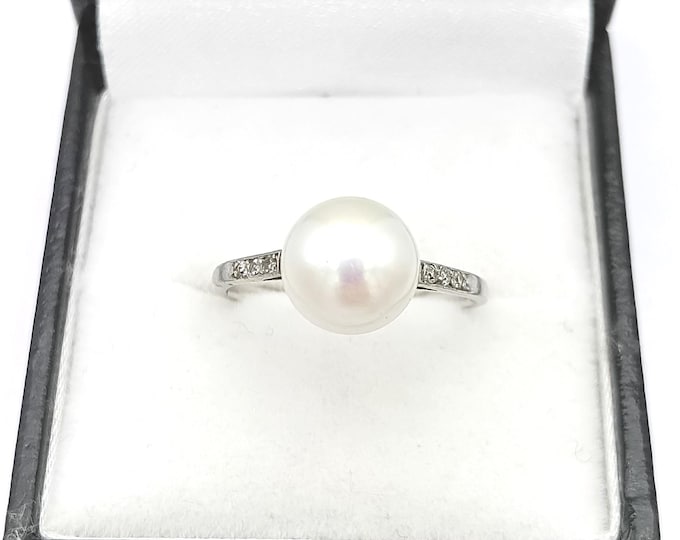 French platinum pearl and diamond solitaire ring