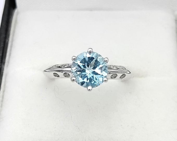 Vintage platinum solitaire aquamarine and diamond ring