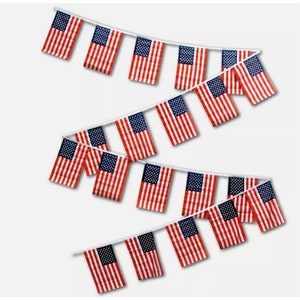 May include: A string of American flag pennants, each flag is red, white, and blue with stars. The flags are strung together on a white string.