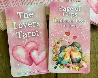 May include: Two tarot cards from the Lovers Tarot deck. The first card is a pink card with the text "The Lovers Tarot" and two pink hearts. The second card is a pink card with the text "Page of Cups" and the text "Head over heels in love." The card features two birds kissing and pink hearts.