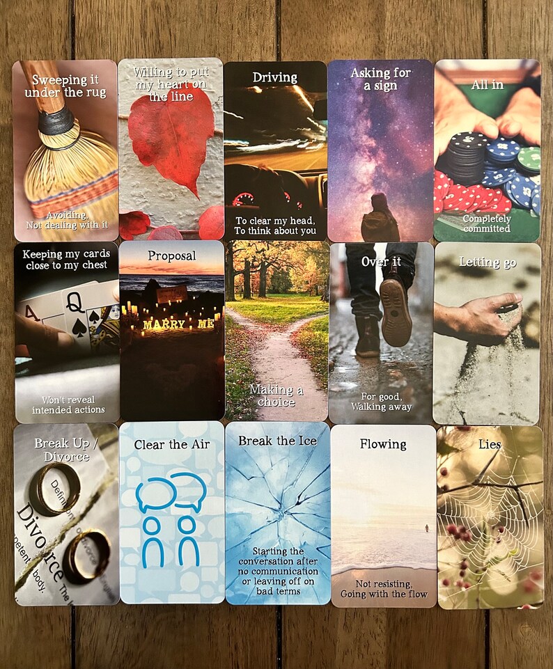 May include: A set of 16 cards with various images and text. The cards are arranged in a 4x4 grid. The text on the cards includes phrases like "Sweeping it under the rug", "Willing to put my heart on the line", "Driving", "Asking for a sign", "All in", "Avoiding", "Not dealing with it", "Proposal", "Over it", "Letting go", "Keeping my cards close to my chest", "Making a choice", "For good, Walking away", "Break Up / Divorce", "Clear the Air", "Break the Ice", "Flowing", "Lies", "To clear my head, To think about you", "Completely committed", "Won't reveal intended actions", "Starting the conversation after no communication or leaving off on bad terms", "Not resisting, Going with the flow".