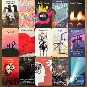 May include: A set of 16 tarot cards with colorful illustrations and text. The cards are arranged in a 4x4 grid on a wooden surface. The cards feature themes such as truth, gaslighting, compromise, and therapy.