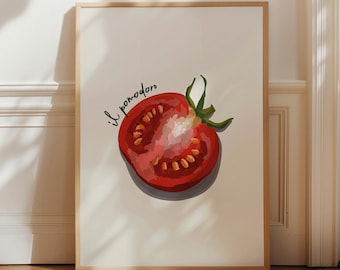 May include: A framed wall art print featuring a realistic illustration of a sliced red tomato with green leaves on a cream background. The text "il pomodoro" is written in black cursive script above the tomato, which shows visible seeds and pulp.