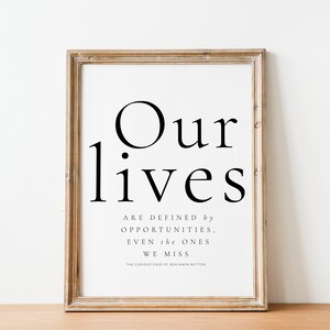 May include: A framed print with a black and white quote that reads "Our lives are defined by opportunities, even the ones we miss. The Curious Case of Benjamin Button."