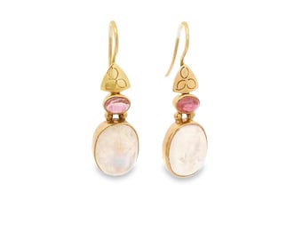 May include: A pair of gold-colored earrings with a three-petal design at the top, a pink gemstone in the middle, and a large, oval, white gemstone at the bottom. The earrings are displayed against a white background.