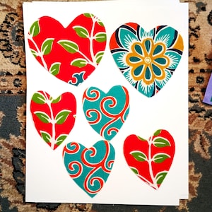 Sets of applique patches: hearts, strips and diamonds