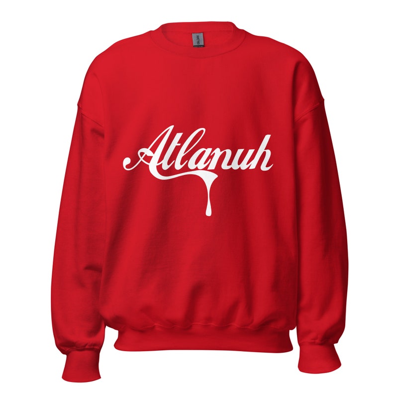 May include: Red sweatshirt with a white graphic that says "Atlanuh" in a dripping font.