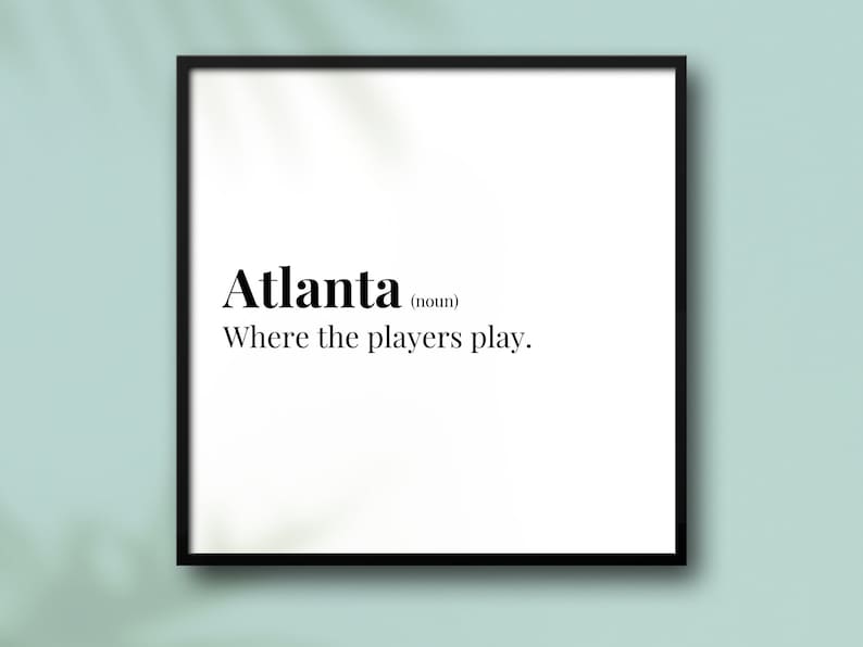 May include: Black and white typography print with the word "Atlanta" defined as "Where the players play."
