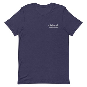 May include: A navy blue t-shirt with a white embroidered logo that says "Atlanuh Established 1847".
