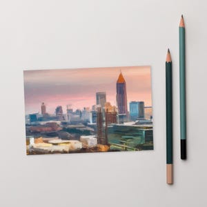 May include: A painting of a city skyline at sunset. The buildings are painted in a variety of colors, including brown, blue, and green. The sky is a soft pink and orange.