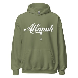 May include: A green hooded sweatshirt with a white graphic that says "Atlanuh" in a dripping font.
