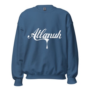 May include: A blue sweatshirt with white text that reads "Atlanuh" in a dripping font.